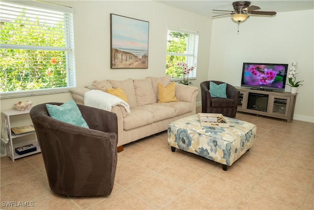 tiled living room featuring ceiling fan