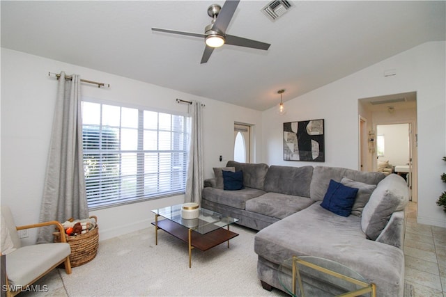 living room featuring vaulted ceiling and ceiling fan