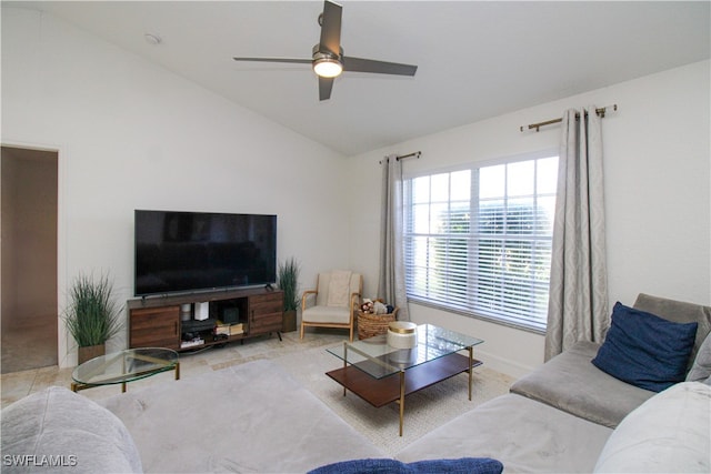 living room with ceiling fan and vaulted ceiling