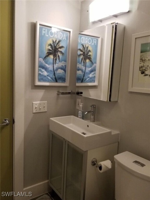 bathroom with vanity and toilet