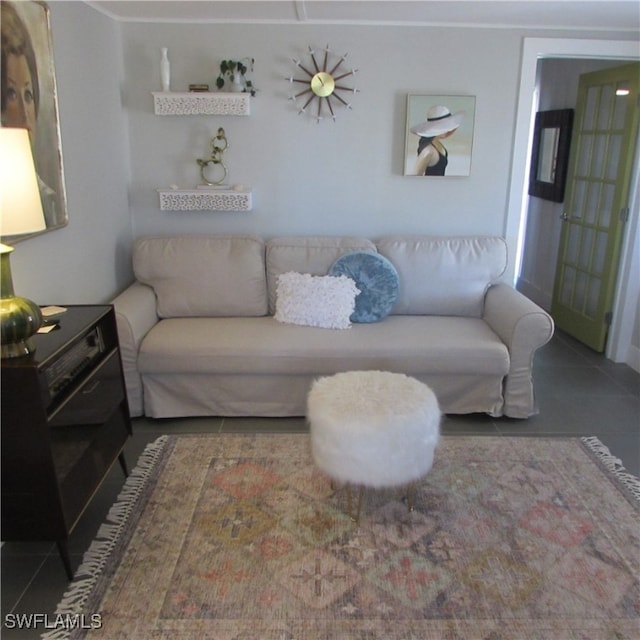 living room with dark tile patterned floors