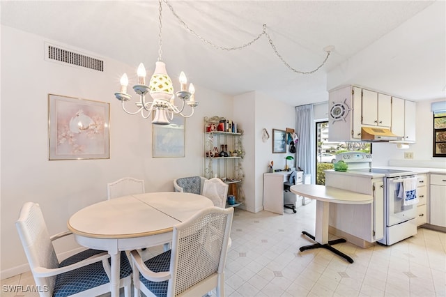 dining room featuring a notable chandelier