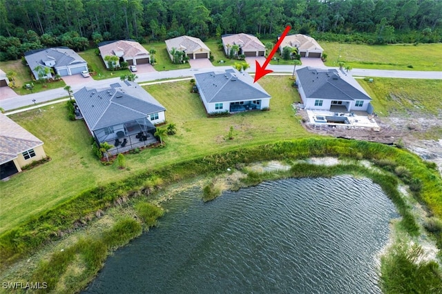 birds eye view of property featuring a water view