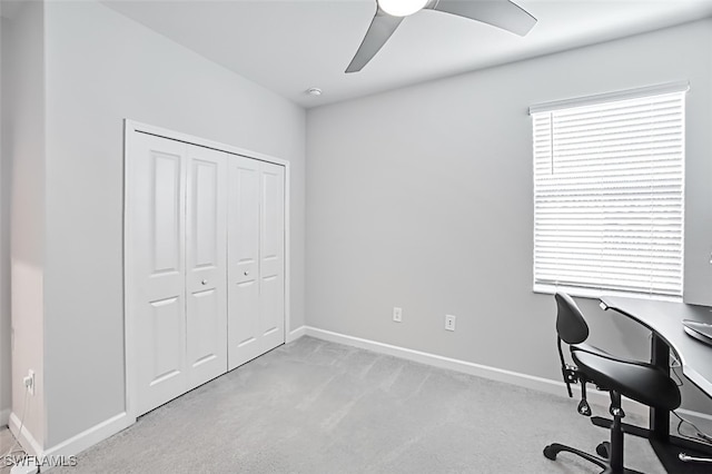 office area with ceiling fan and light colored carpet