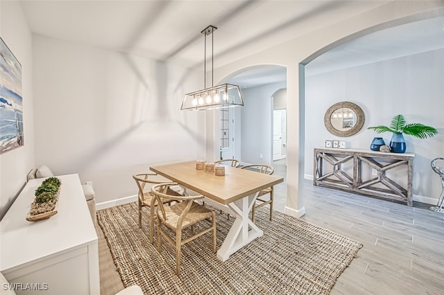 dining area featuring light wood-type flooring