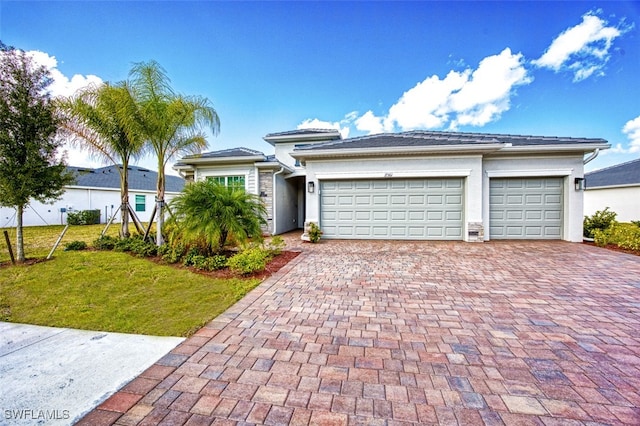 view of front facade featuring a front lawn and a garage