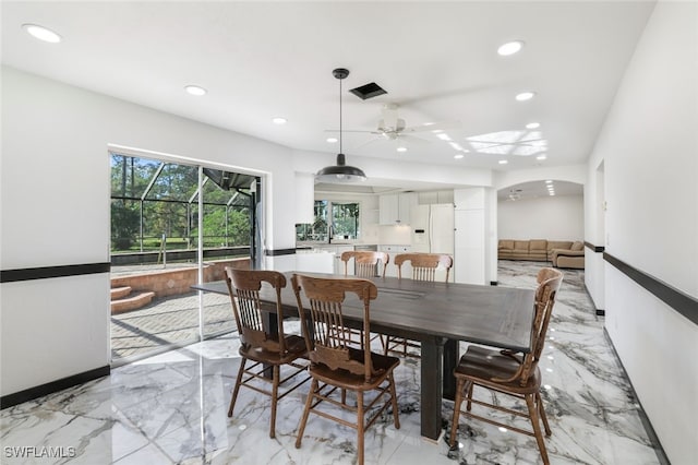 dining area with ceiling fan