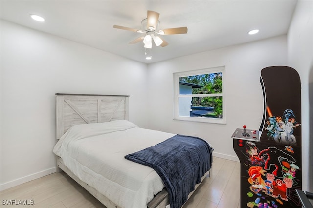 bedroom featuring light hardwood / wood-style flooring and ceiling fan