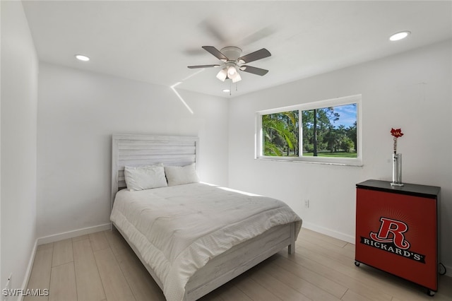 bedroom featuring light hardwood / wood-style flooring and ceiling fan