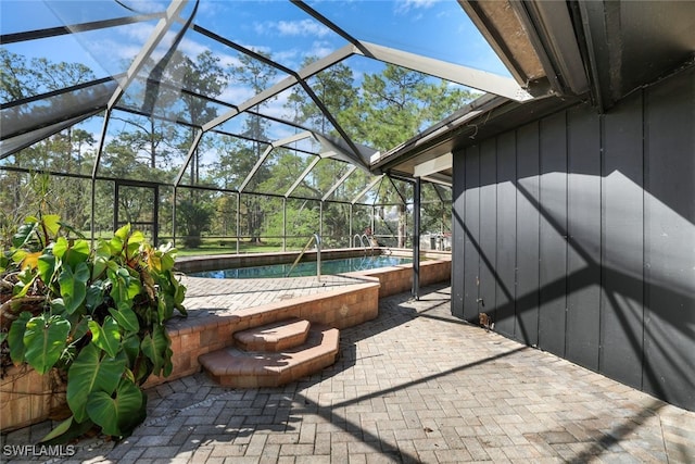 view of patio / terrace featuring a lanai