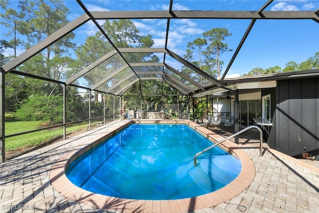 view of pool featuring a patio area and a lanai