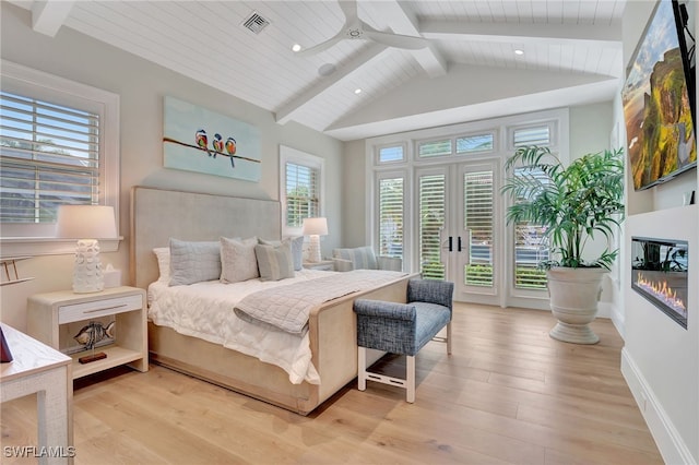 bedroom with access to exterior, light wood-style flooring, a glass covered fireplace, baseboards, and wooden ceiling