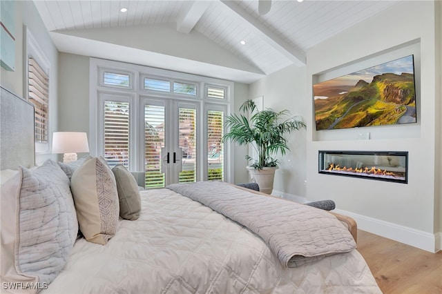 bedroom with access to outside, vaulted ceiling with beams, light wood-type flooring, and french doors