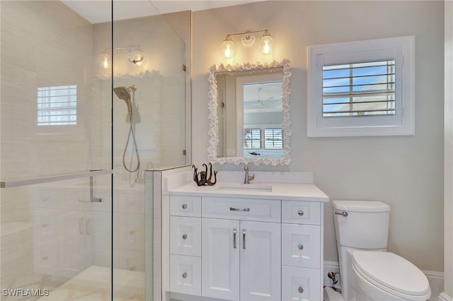 full bathroom with a stall shower, toilet, and healthy amount of natural light