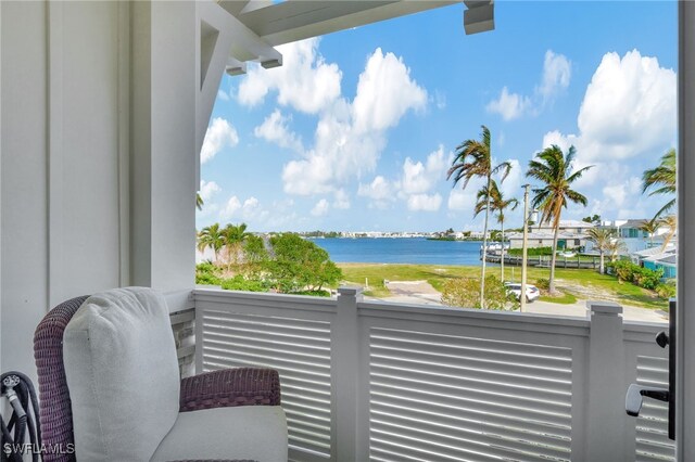 balcony featuring a water view