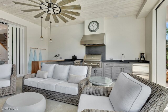 living room featuring stairway, a ceiling fan, and wooden ceiling