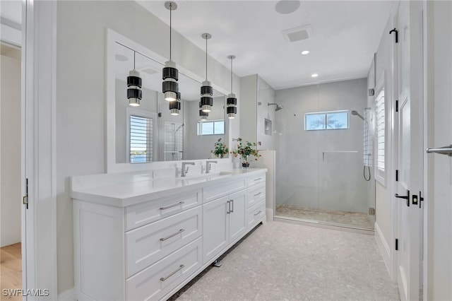 full bathroom featuring a stall shower, plenty of natural light, vanity, and recessed lighting