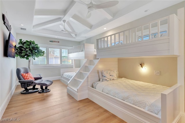 bedroom with ceiling fan, beamed ceiling, coffered ceiling, and hardwood / wood-style flooring