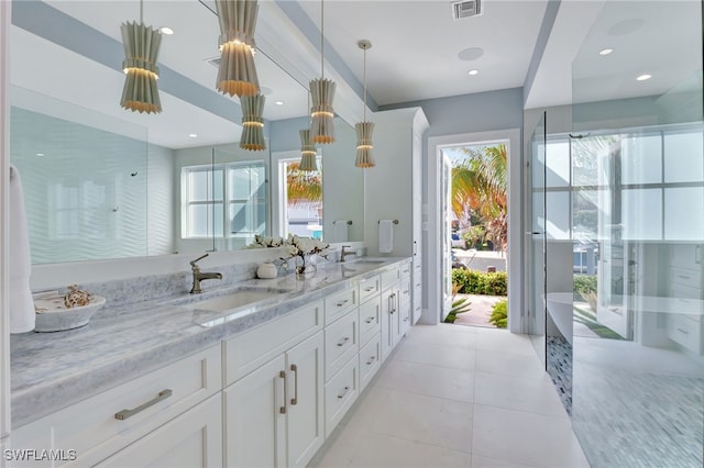 bathroom featuring double vanity, tile patterned floors, and recessed lighting