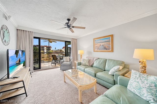 carpeted living room with crown molding, a textured ceiling, and ceiling fan