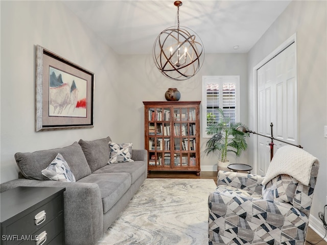 living room featuring an inviting chandelier and hardwood / wood-style flooring