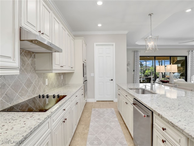 kitchen with black electric stovetop, white cabinets, stainless steel dishwasher, and hanging light fixtures