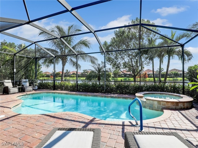 view of pool with a patio, a lanai, and an in ground hot tub