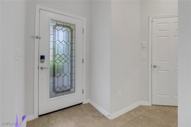 foyer featuring light tile patterned flooring