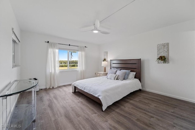 bedroom with hardwood / wood-style flooring and ceiling fan