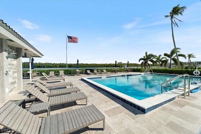 view of swimming pool featuring a patio area