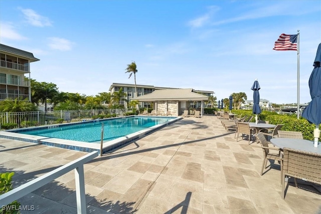 view of swimming pool with a patio area