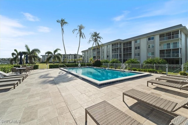 view of swimming pool featuring a patio