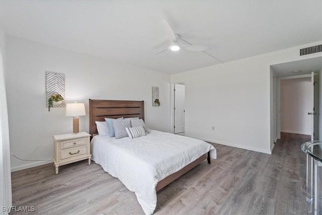 bedroom featuring ceiling fan and hardwood / wood-style floors