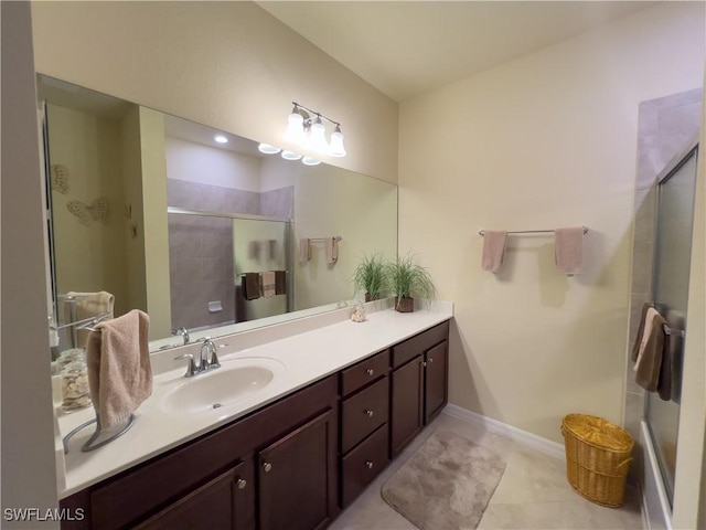 bathroom with vanity and a shower with shower door