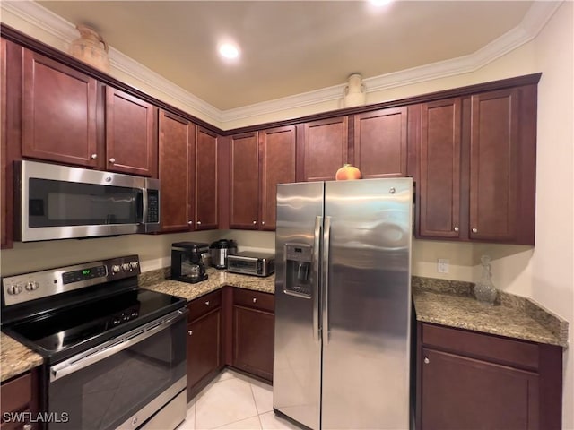 kitchen with light tile patterned floors, crown molding, light stone countertops, and appliances with stainless steel finishes