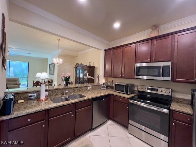 kitchen with sink, light tile patterned floors, kitchen peninsula, pendant lighting, and stainless steel appliances