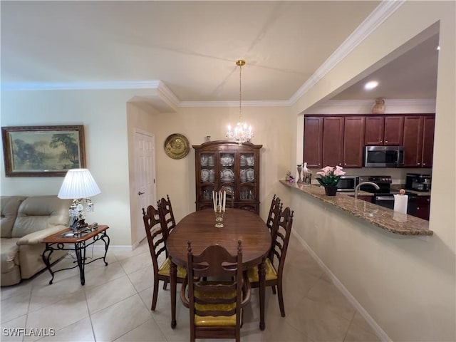 dining space with light tile patterned floors, a notable chandelier, ornamental molding, and sink