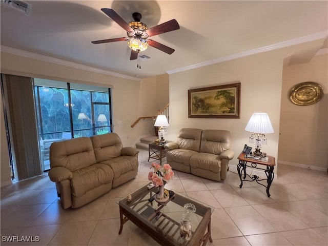 living room with ornamental molding, light tile patterned flooring, and ceiling fan