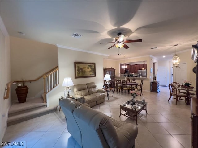 living room with ceiling fan with notable chandelier, ornamental molding, and light tile patterned flooring