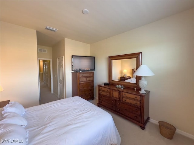 bedroom with light carpet