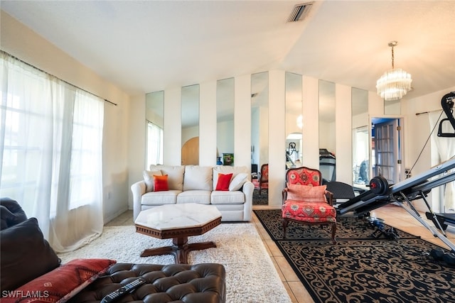 tiled living room featuring vaulted ceiling and a notable chandelier