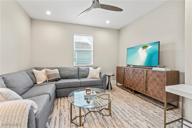 living room featuring hardwood / wood-style flooring and ceiling fan