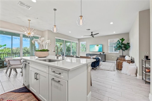 2319 Sawyers Hill Rd Unit 708, Naples, FL 34120 - kitchen featuring visible vents, a healthy amount of sunlight, and a sink