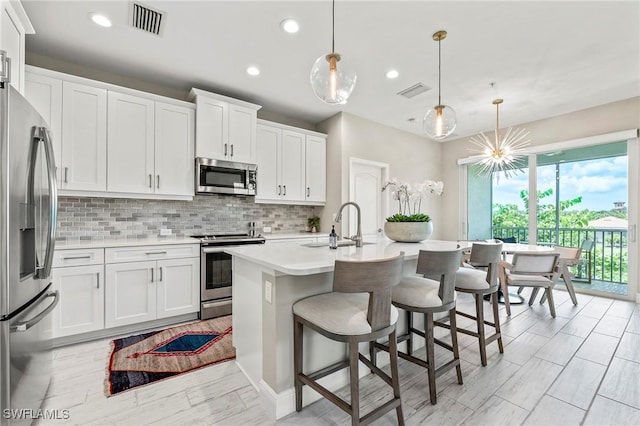 2319 Sawyers Hill Rd Unit 708, Naples, FL 34120 - kitchen with visible vents, light countertops, recessed lighting, and stainless steel appliances