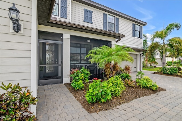 entrance to property featuring a garage