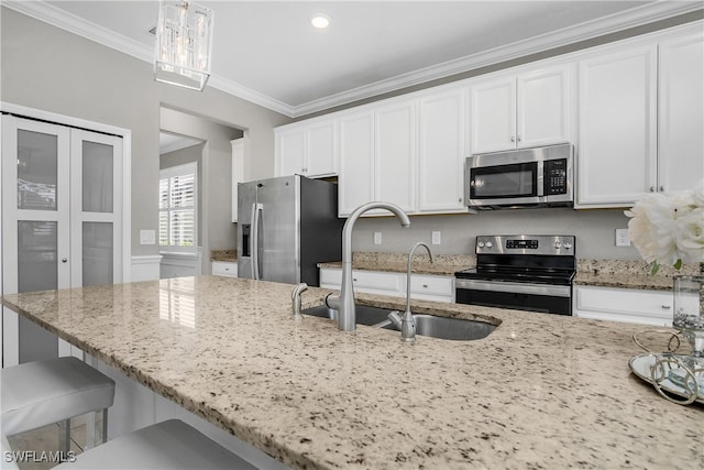 kitchen with light stone counters, crown molding, stainless steel appliances, and hanging light fixtures