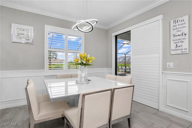 17641 Brooksin Ct, Estero, FL 33928 - dining space with ornamental molding and a notable chandelier