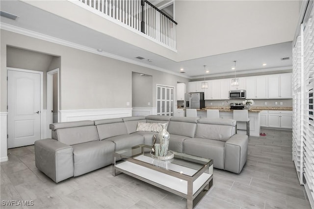 17641 Brooksin Ct, Estero, FL 33928 - living room featuring crown molding and a high ceiling
