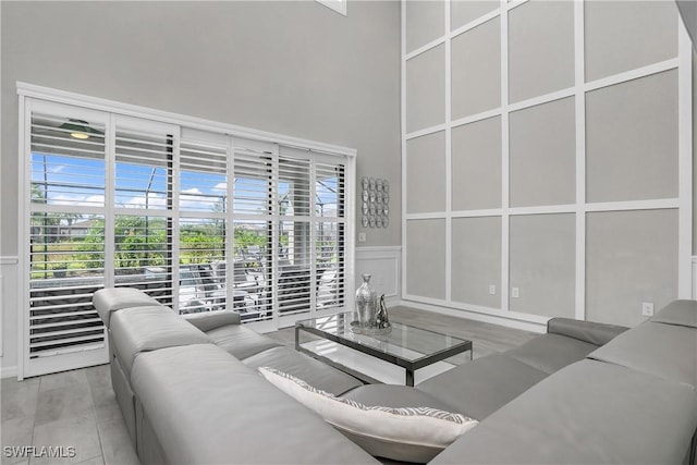 17641 Brooksin Ct, Estero, FL 33928 - living room featuring wood-type flooring and a high ceiling