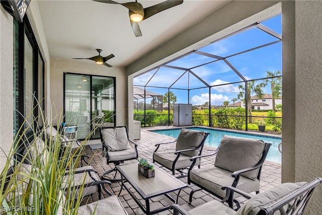 view of patio / terrace featuring ceiling fan and a lanai